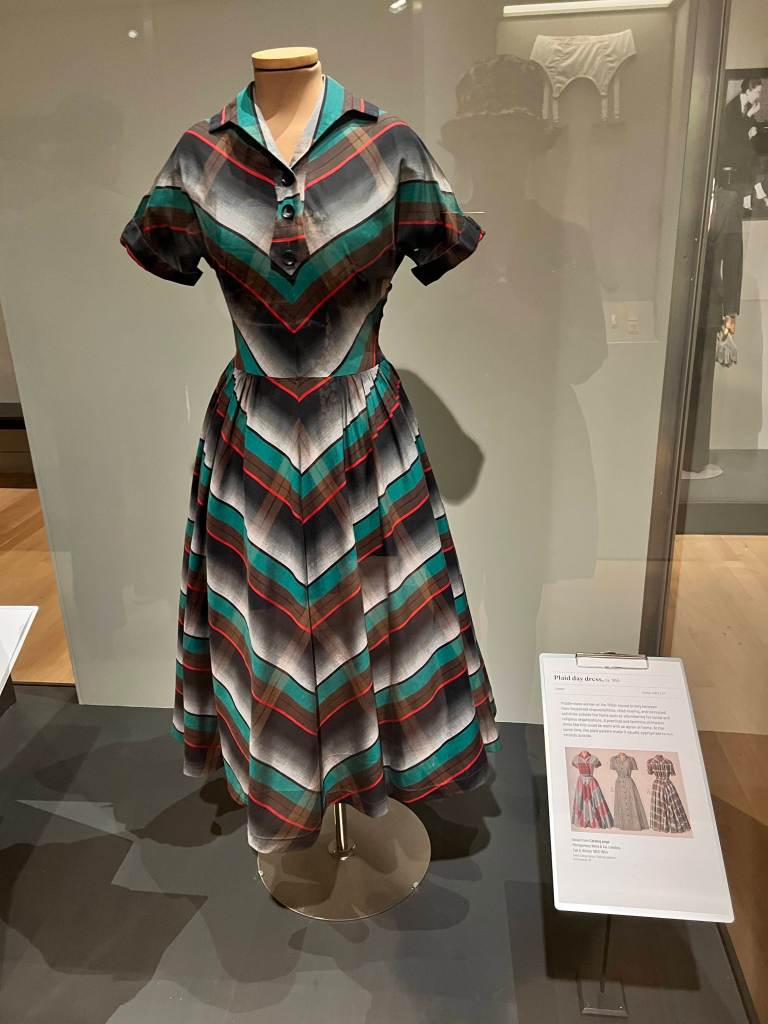 1955: Plaid cotton day dress with bodice and short sleeves cut in one piece and on the bias
