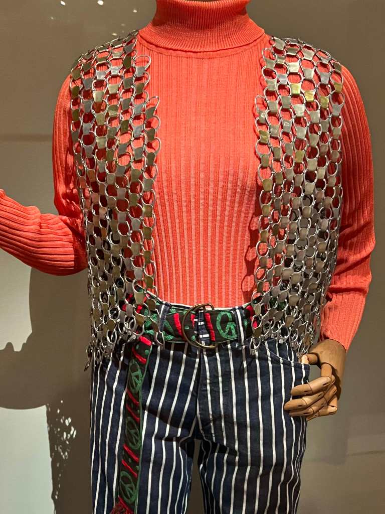 A 1971 vest made from aluminum pull-tabs with striped Levi's bell-bottoms